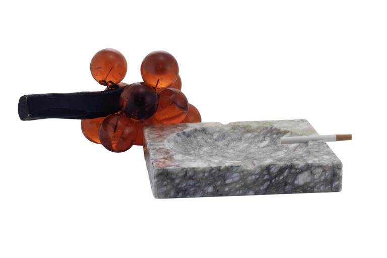 Large outdoor ashtray hand-carved in Alabaster stone. The original owner placed an I.D. label on the seat of the ashtray noting the date of 1965. It's large, heavy and perfect for outside.