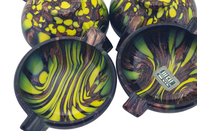 Set of four unused Venetian glass ashtrays with aventurine and monochrome décor in ebony black glass.